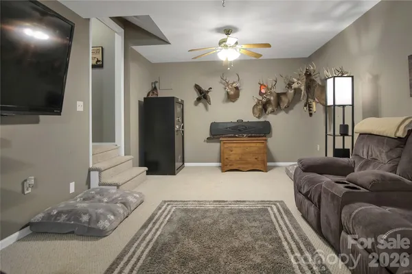 a view of game room with window and tv