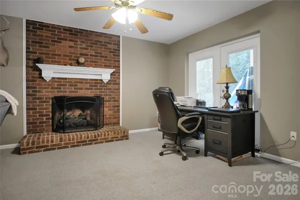 a dining room with furniture and a chandelier