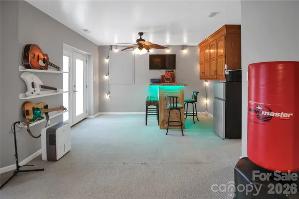 a view of a livingroom with furniture and a flat screen tv