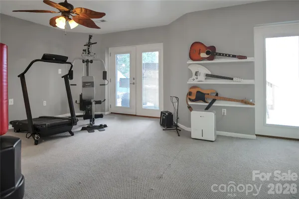 a bedroom with a bed and chair