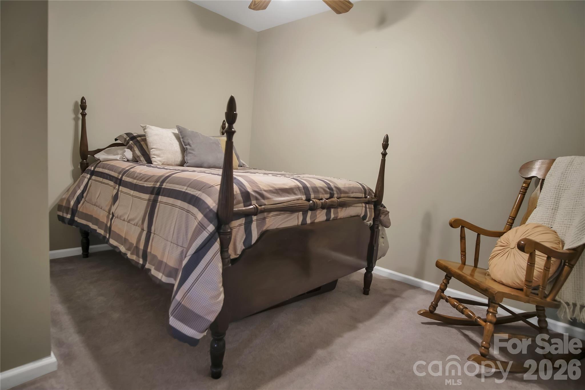 120 Oak Point Drive Cherryville, NC 28021 - Photo 40 of 44 a bedroom with a bed and chair