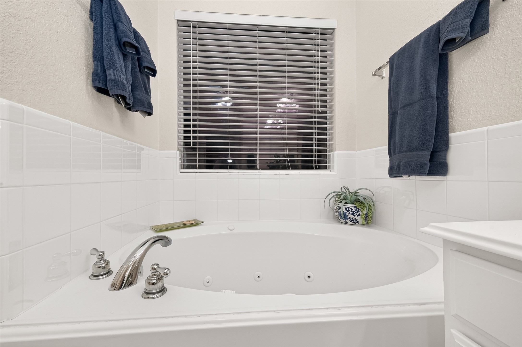 12455 West Summerlin Conroe, TX 77302 - Photo 21 of 31 a bathroom with a bathtub and a window