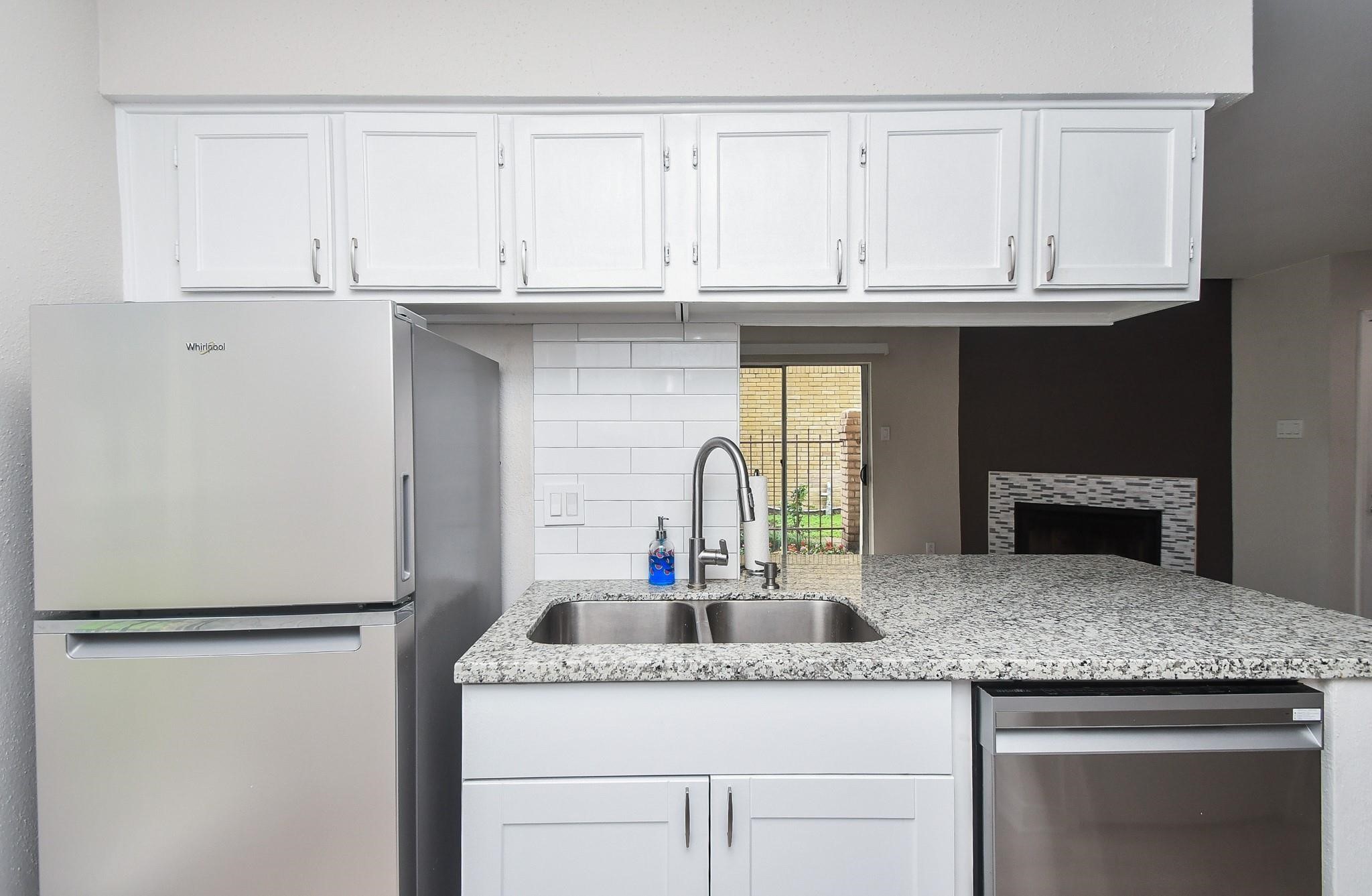2120 El Paseo Street Houston, TX 77054 - Photo 14 of 31 a kitchen with granite countertop a sink and cabinets