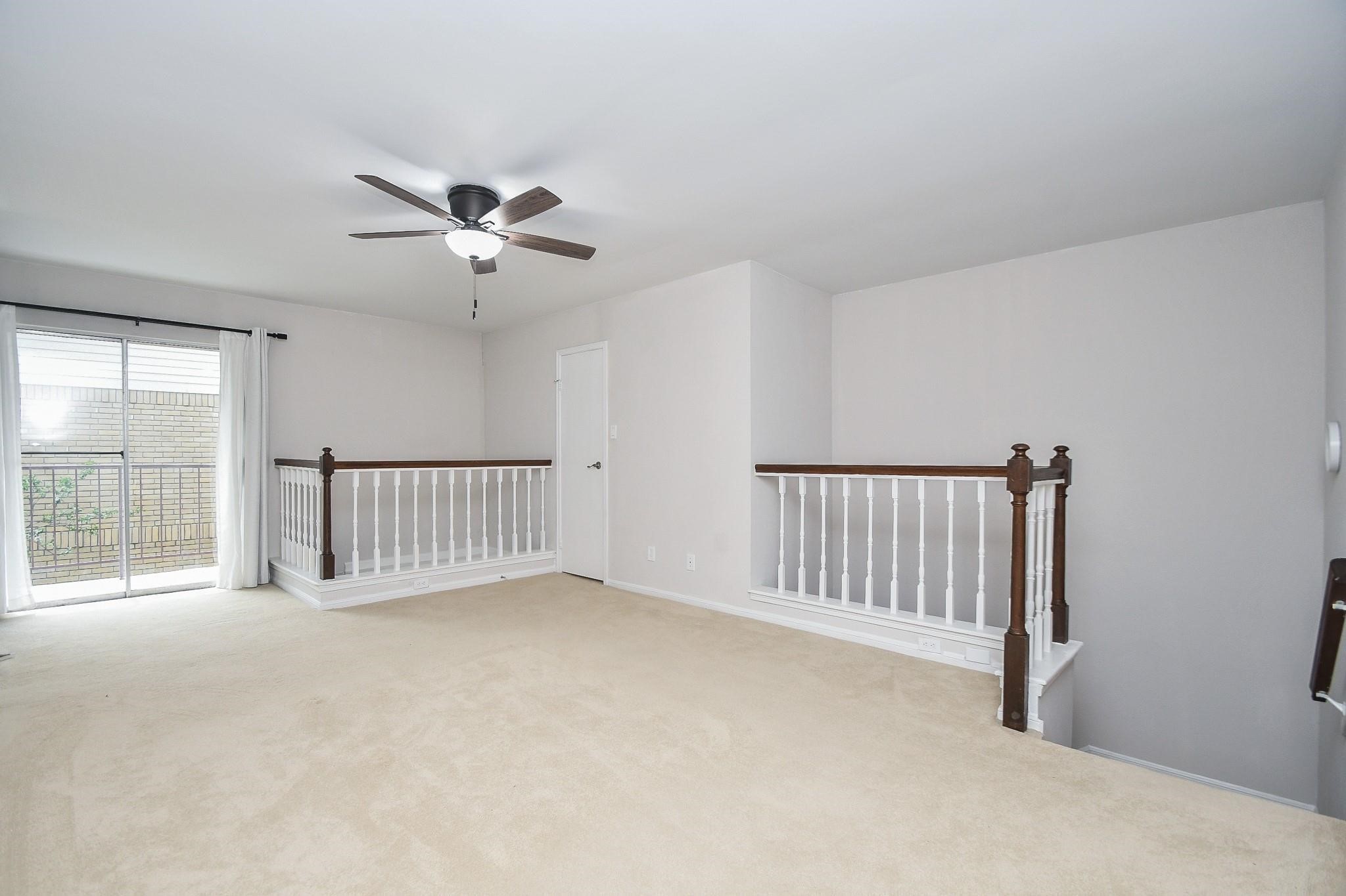 2120 El Paseo Street Houston, TX 77054 - Photo 18 of 31 a view of a livingroom with a ceiling fan and window