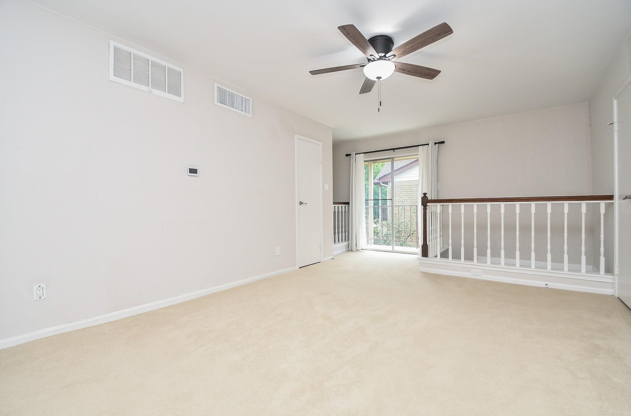 2120 El Paseo Street Houston, TX 77054 - Photo 21 of 31 an empty room with ceiling fan and window