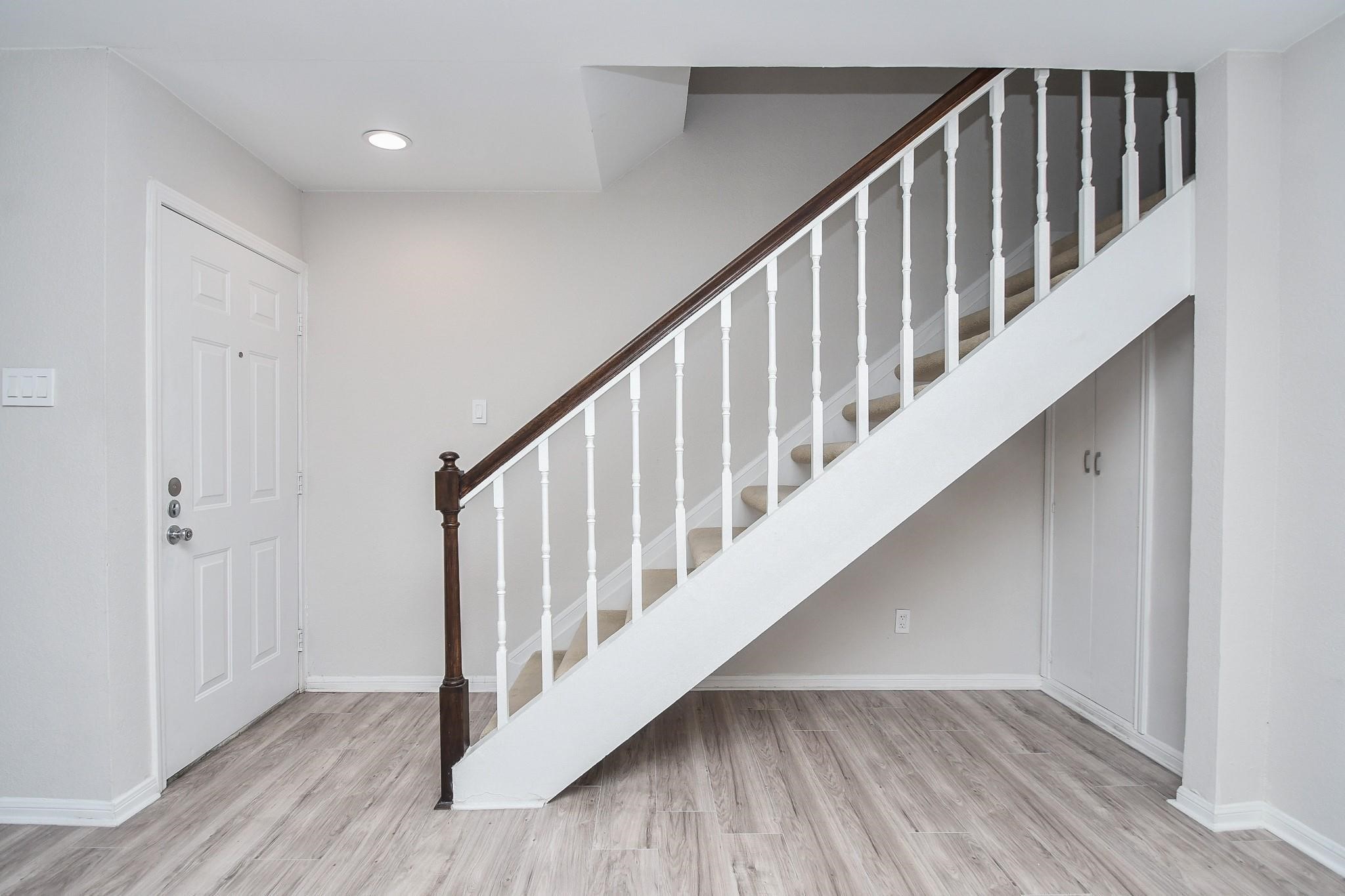 2120 El Paseo Street Houston, TX 77054 - Photo 4 of 31 a view of staircase with wooden floor and white walls