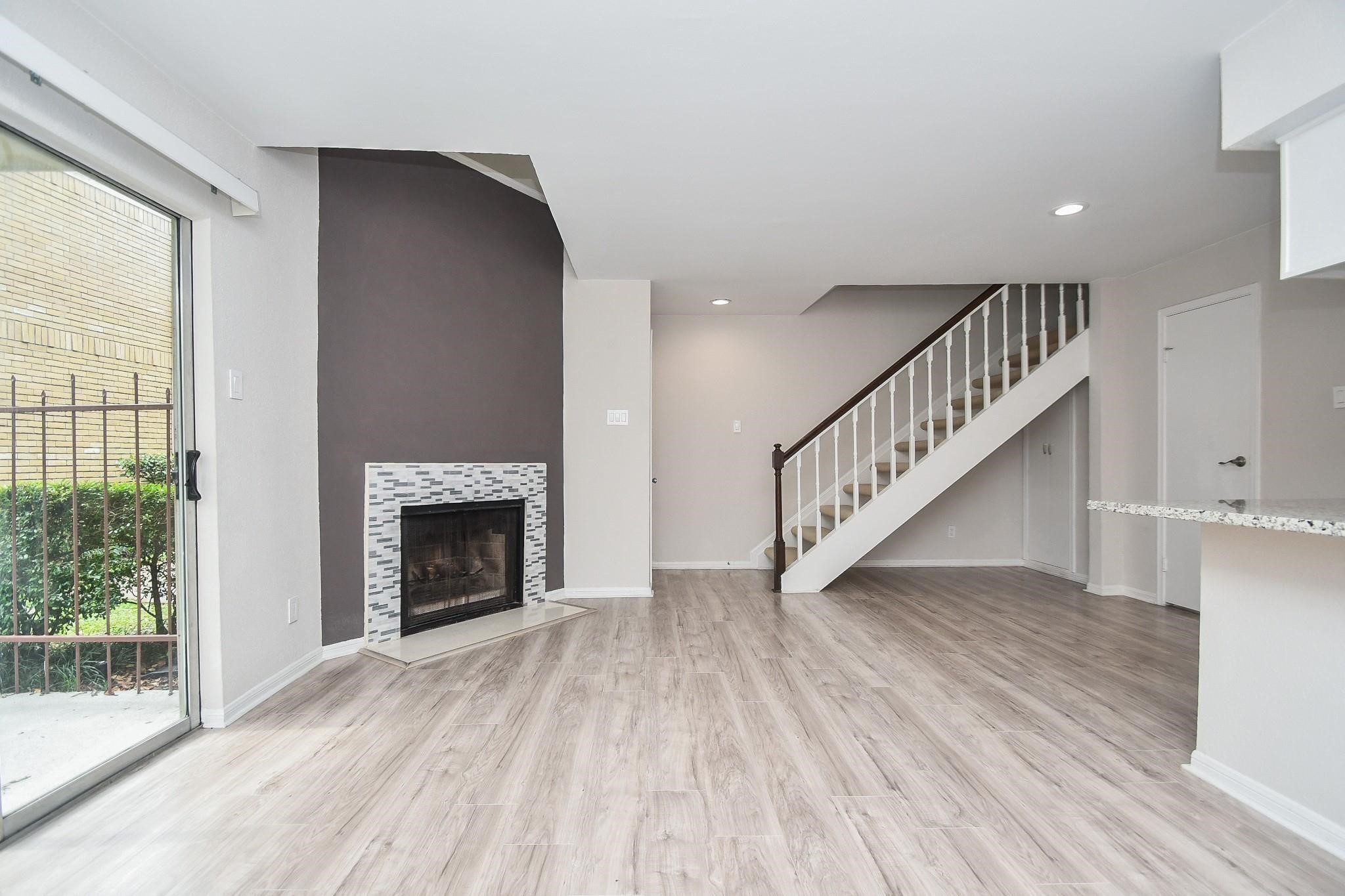 2120 El Paseo Street Houston, TX 77054 - Photo 7 of 31 a view of entryway and hall with wooden floor