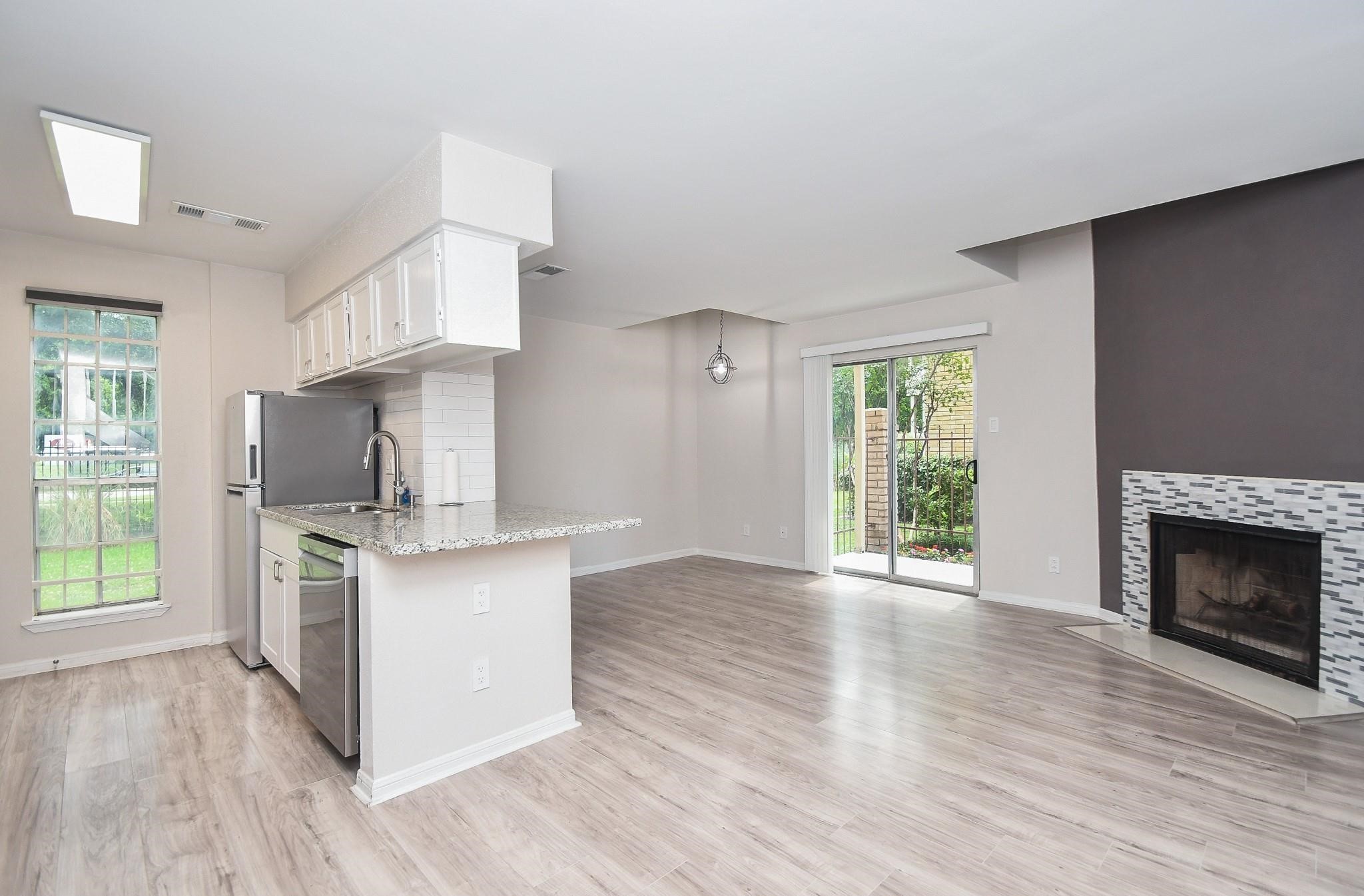 2120 El Paseo Street Houston, TX 77054 - Photo 9 of 31 a kitchen with stainless steel appliances a stove top oven and a refrigerator