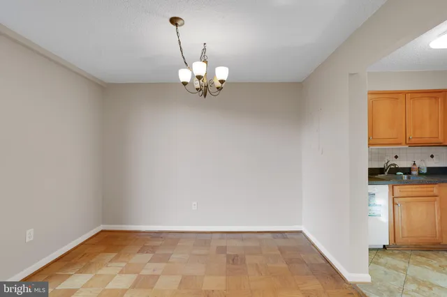 a view of a kitchen with a sink dishwasher and microwave