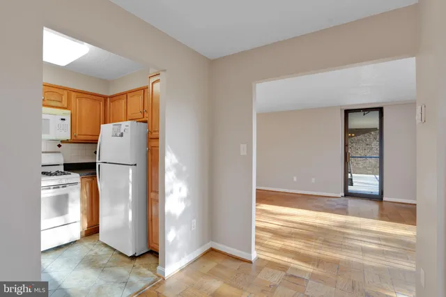 a view of a kitchen with refrigerator and dishwasher