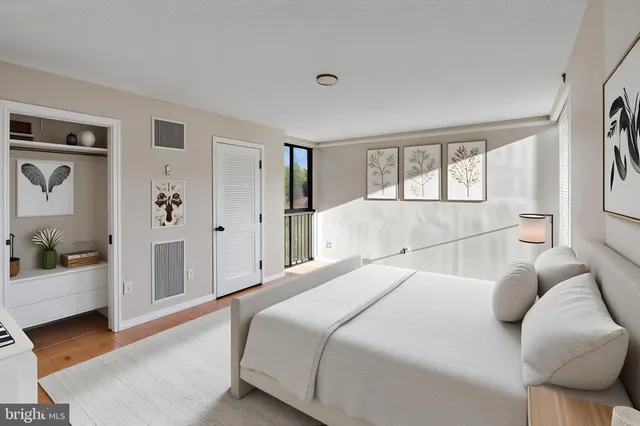 a bedroom with a bed and a couch