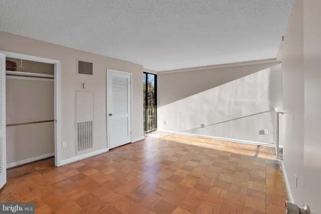 a view of an empty room with a window