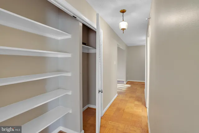 a view of a hallway with closet