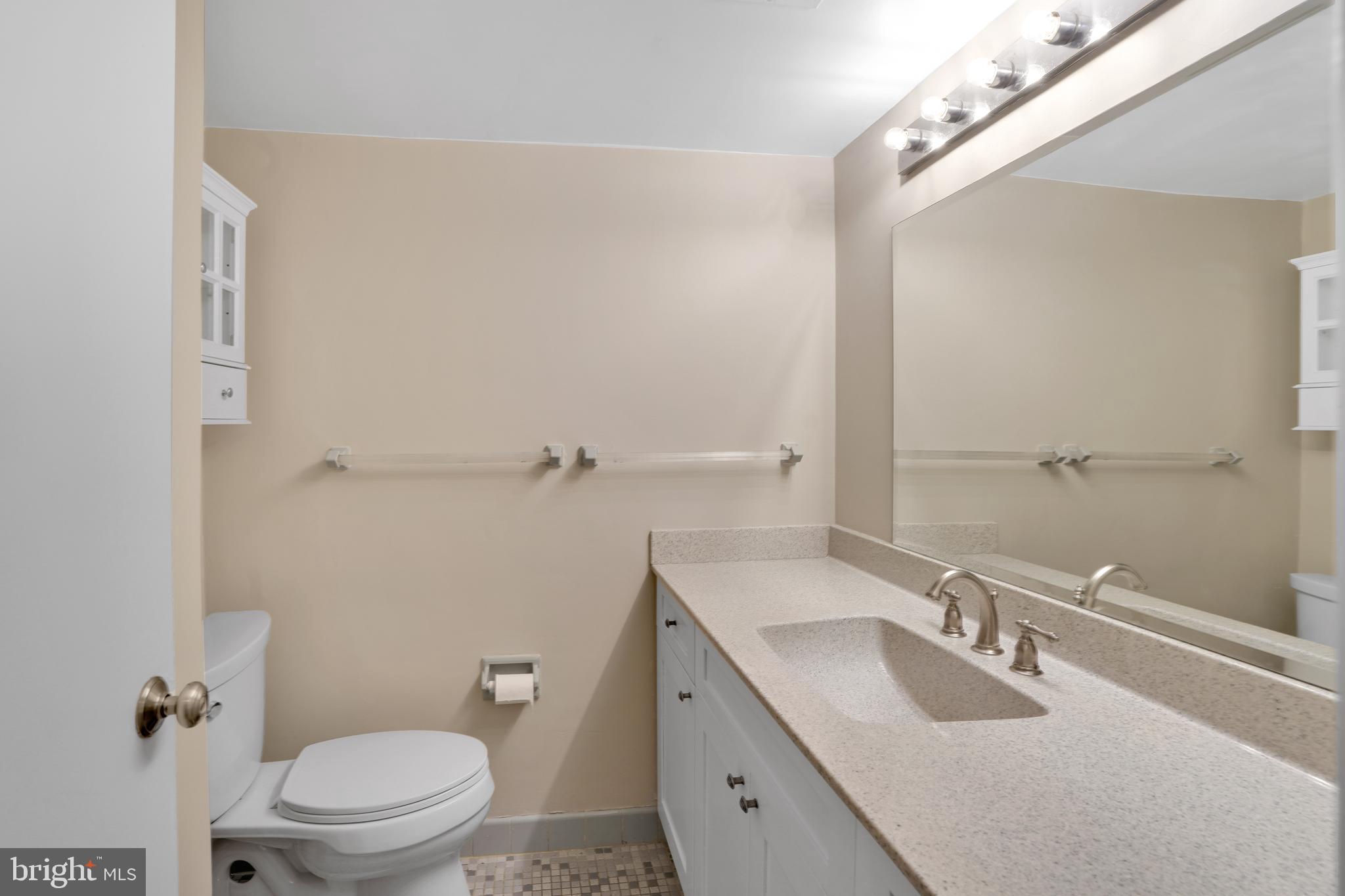 2100 Washington Avenue, Unit 2B Silver Spring, MD 20910 - Photo 22 of 34 a bathroom with a sink toilet and shower