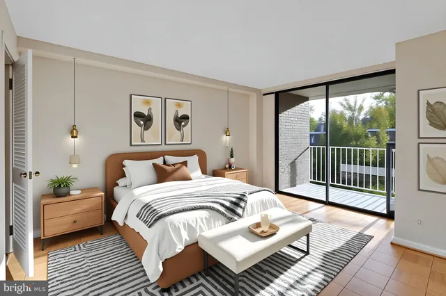 a bedroom with a bed a large mirror and a large window