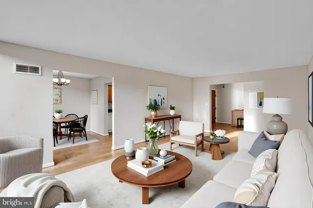 a living room with furniture and a table