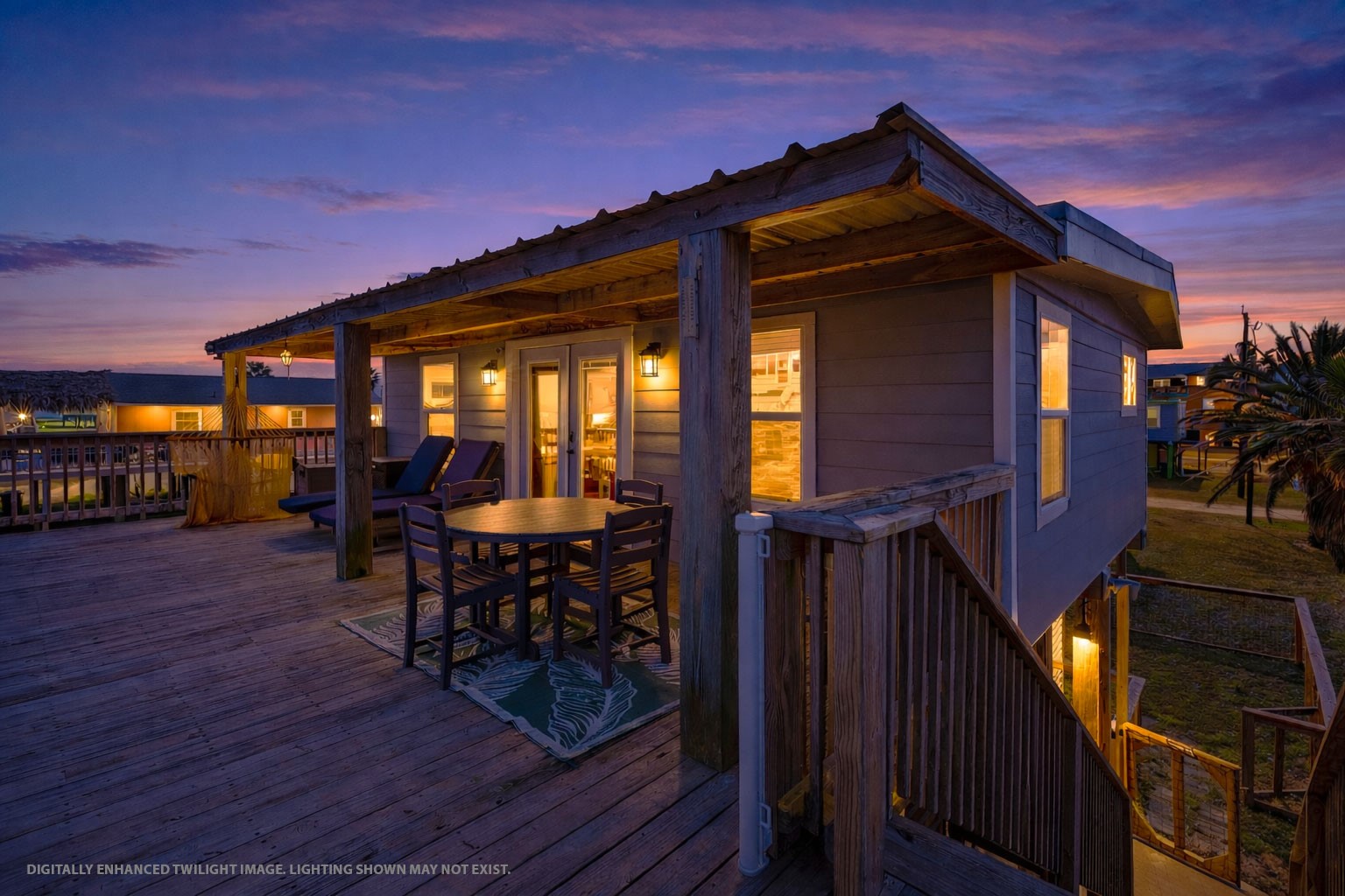 a front view of a house with outdoor seating