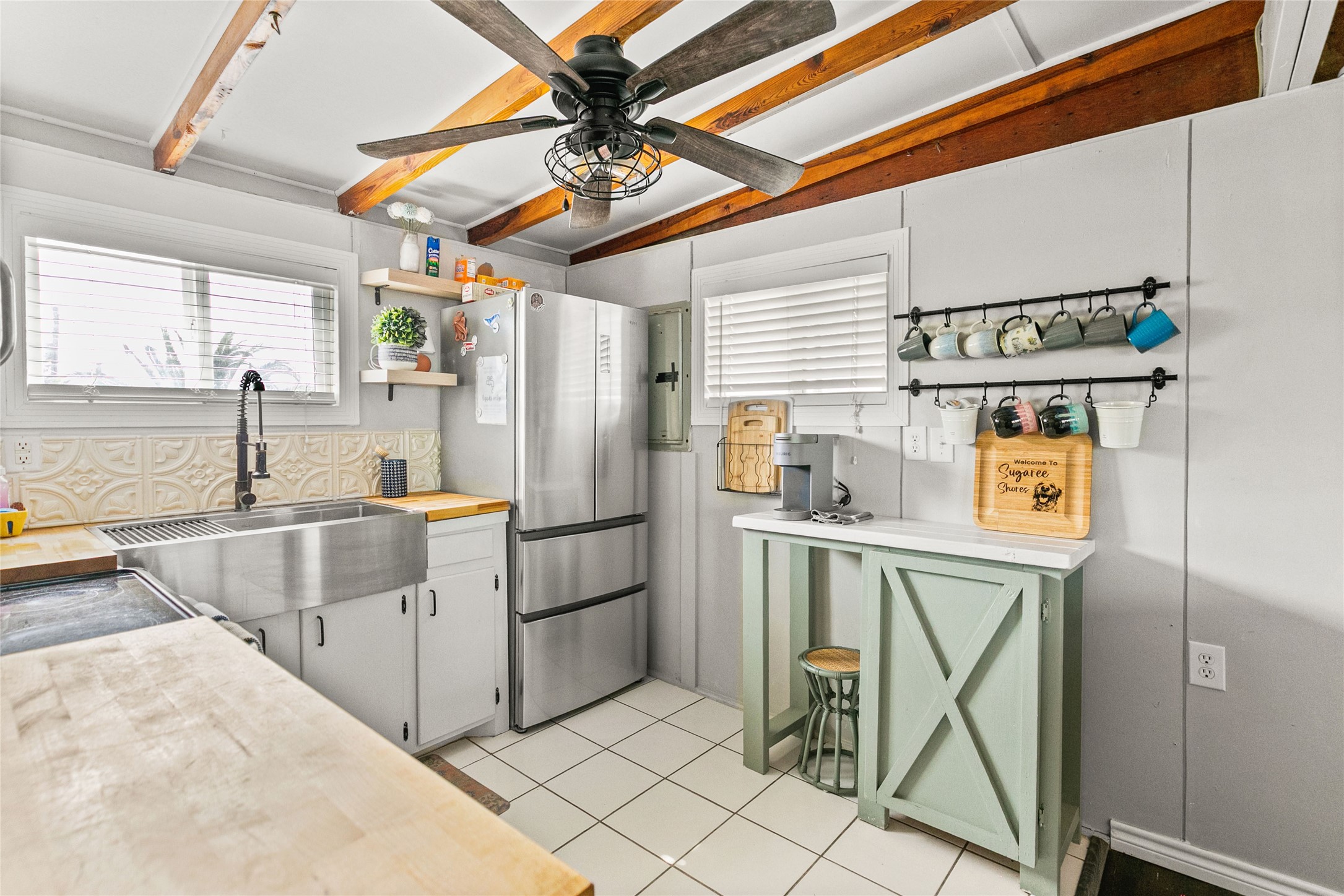 311 Olive Street Surfside Beach, TX 77541 - Photo 12 of 29 a kitchen with stainless steel appliances granite countertop a refrigerator and a sink