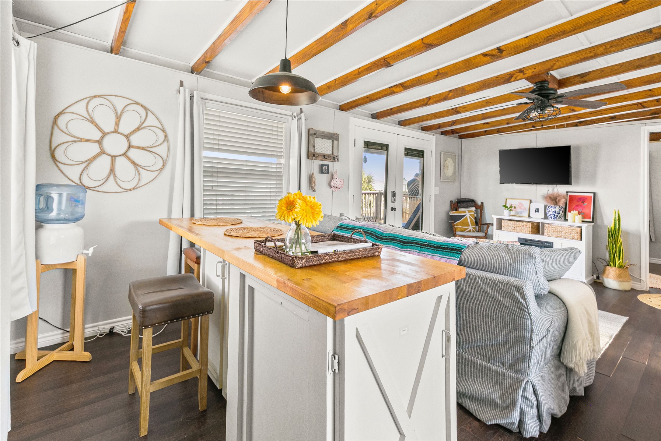 311 Olive Street Surfside Beach, TX 77541 - Photo 13 of 29 a room with furniture and a flat screen tv