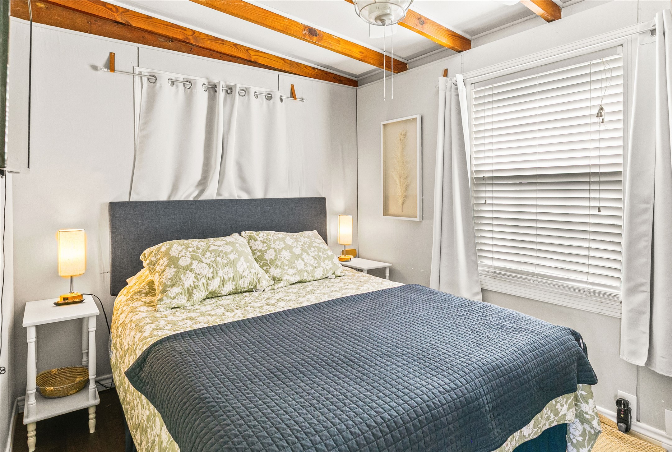 311 Olive Street Surfside Beach, TX 77541 - Photo 17 of 29 a bedroom with a bed and a window