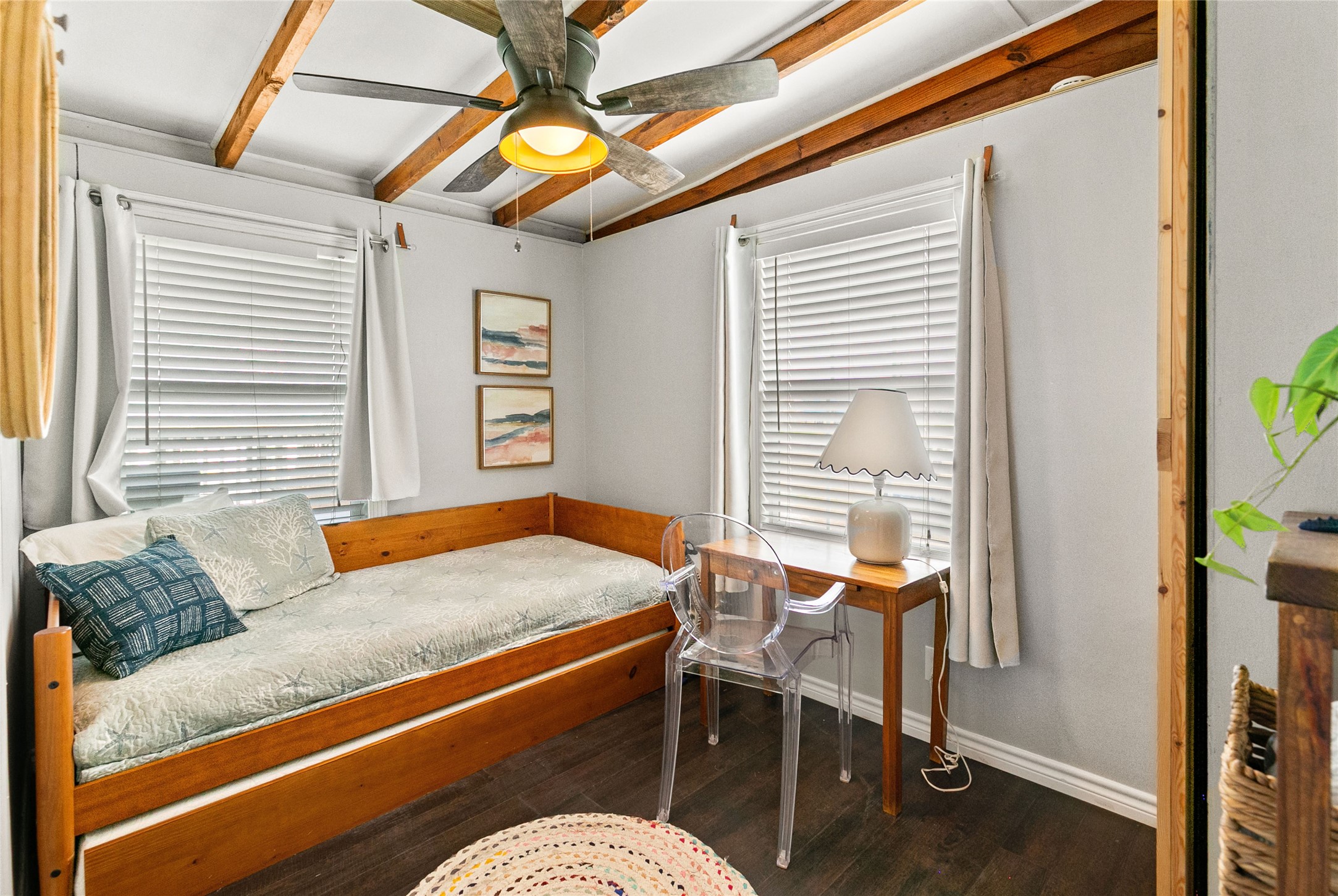 311 Olive Street Surfside Beach, TX 77541 - Photo 19 of 29 a blue chair sitting in front of a window