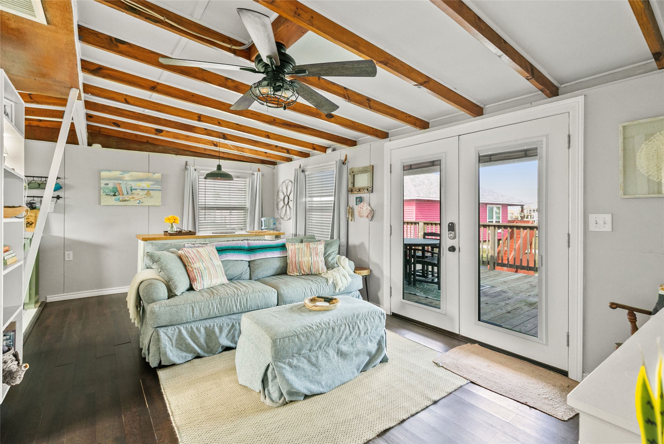 311 Olive Street Surfside Beach, TX 77541 - Photo 21 of 29 a living room with furniture and a chandelier