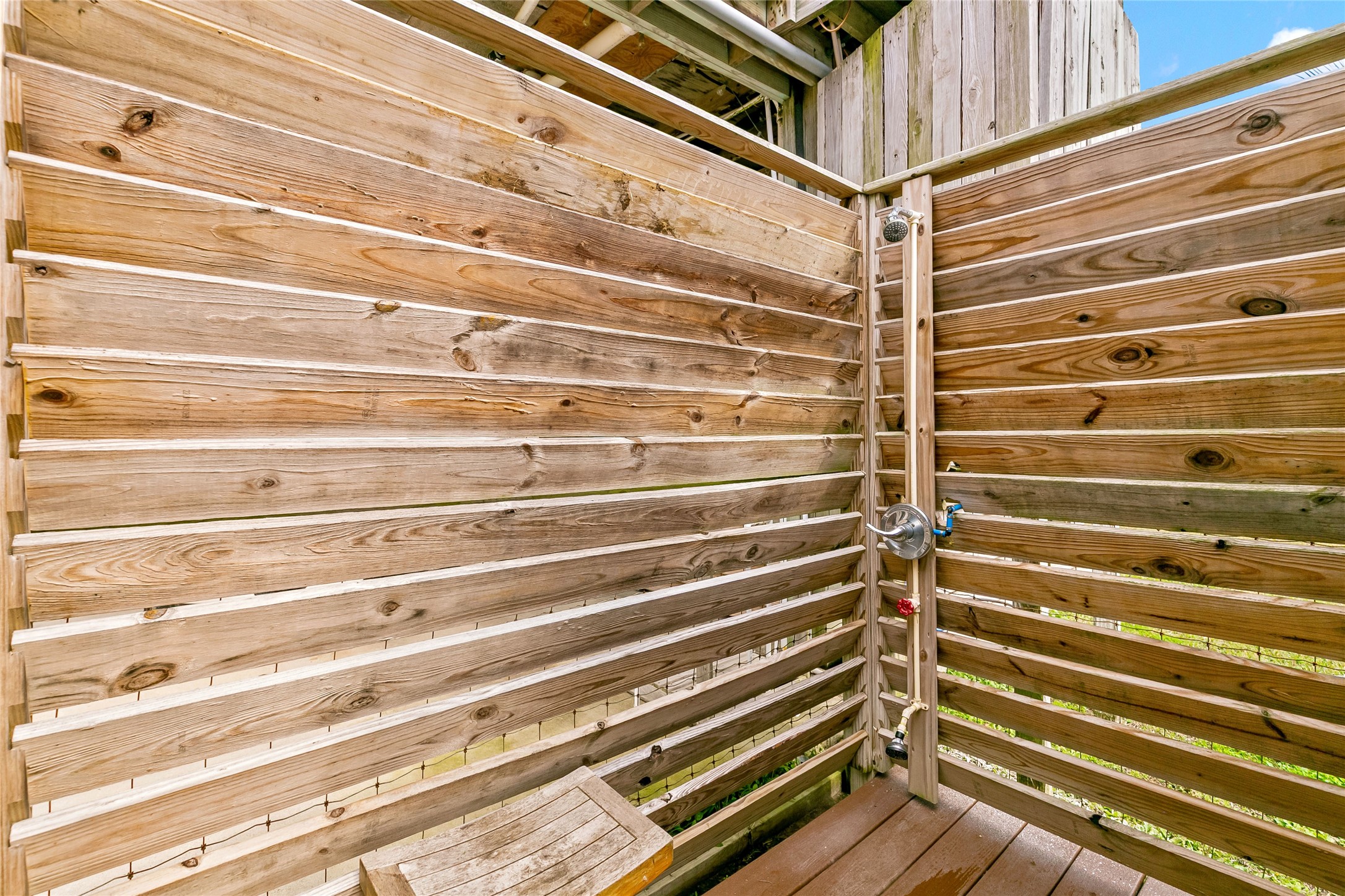 311 Olive Street Surfside Beach, TX 77541 - Photo 25 of 29 a view of a balcony with door and a wooden floor