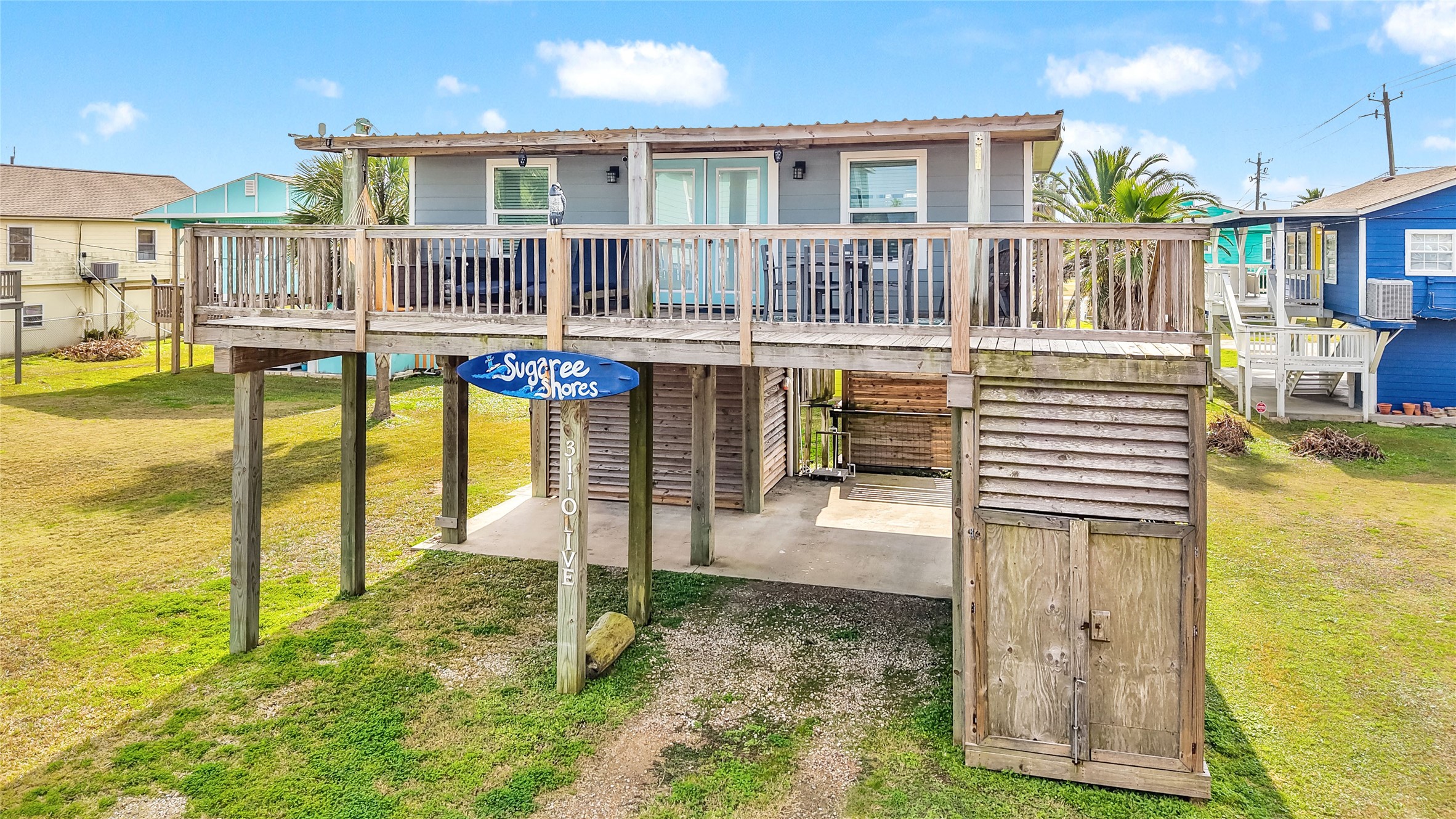 311 Olive Street Surfside Beach, TX 77541 - Photo 3 of 29 a house view with a swimming pool
