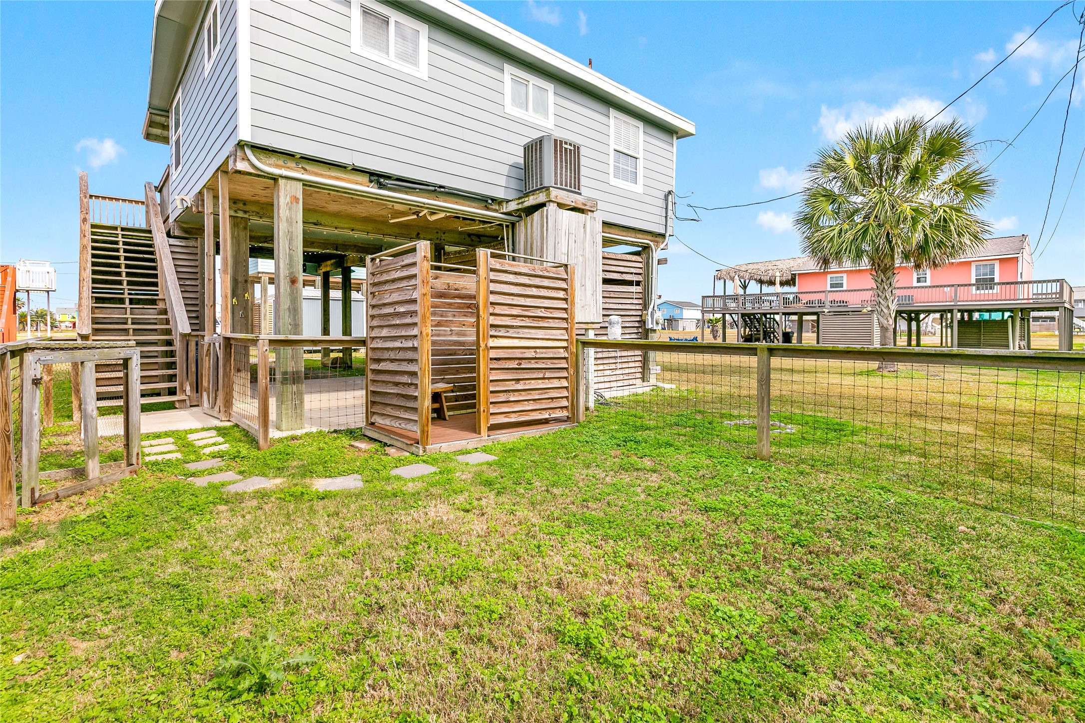 311 Olive Street Surfside Beach, TX 77541 - Photo 5 of 29 a view of a house with a yard
