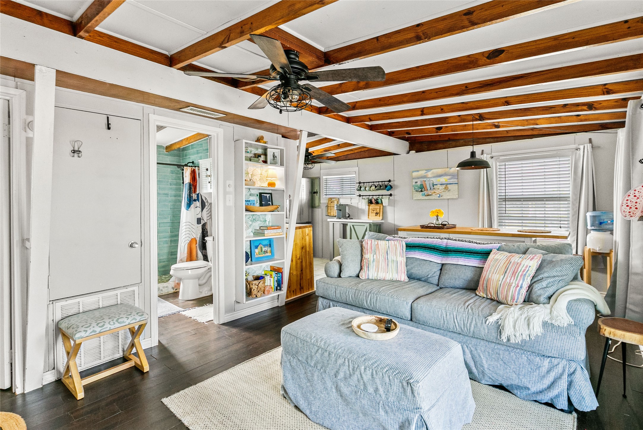 311 Olive Street Surfside Beach, TX 77541 - Photo 8 of 29 a living room with furniture and a chandelier