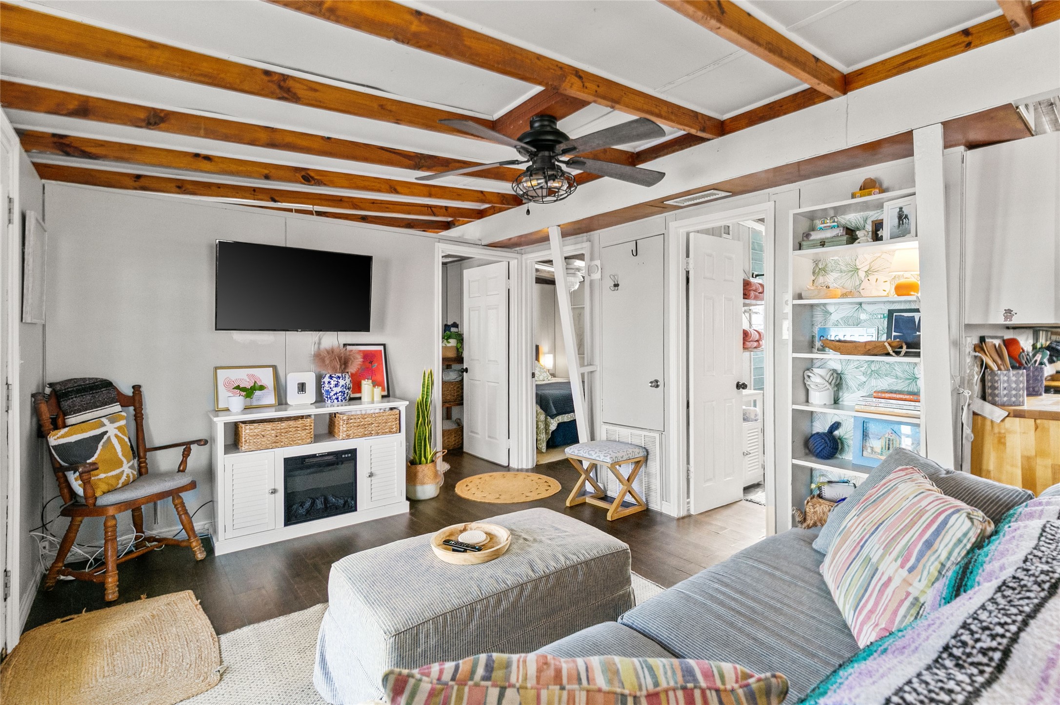 311 Olive Street Surfside Beach, TX 77541 - Photo 9 of 29 a living room with furniture and a flat screen tv