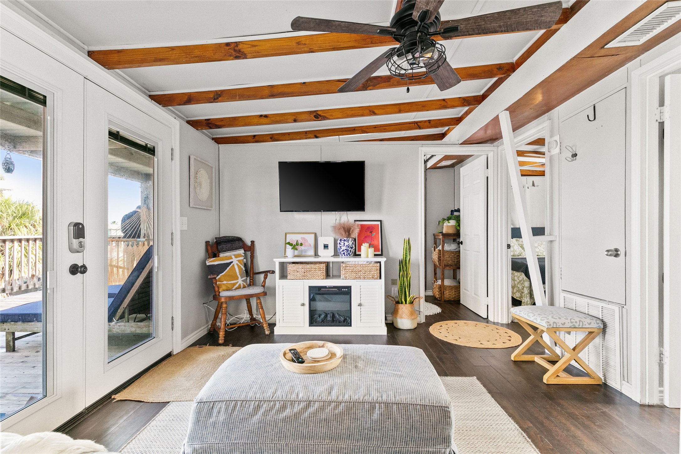 311 Olive Street Surfside Beach, TX 77541 - Photo 10 of 29 a living room with furniture and a flat screen tv