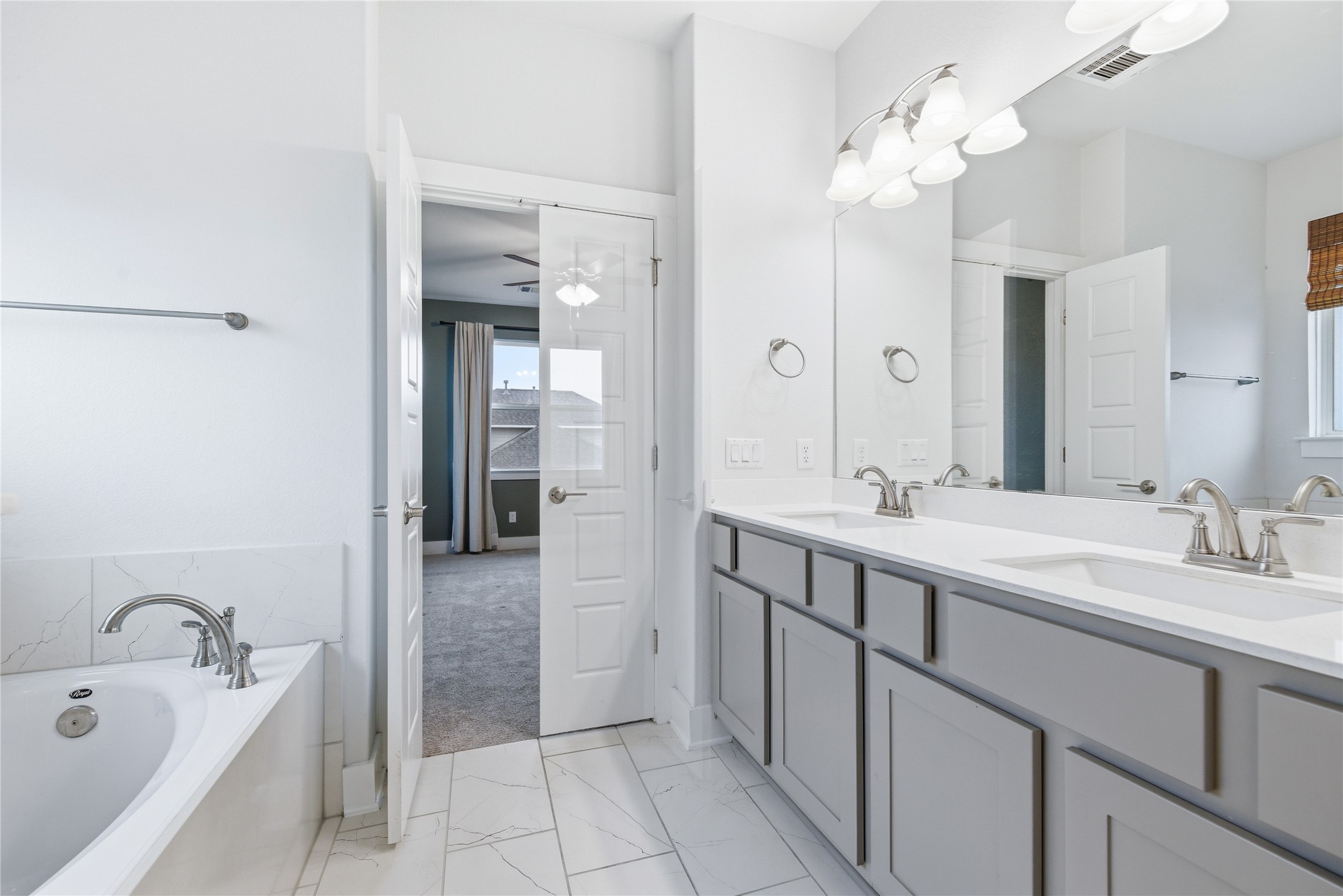 1300 Harwell Loop Kyle, TX 78640 - Photo 17 of 21 a spacious bathroom with a sink double vanity granite and a mirror