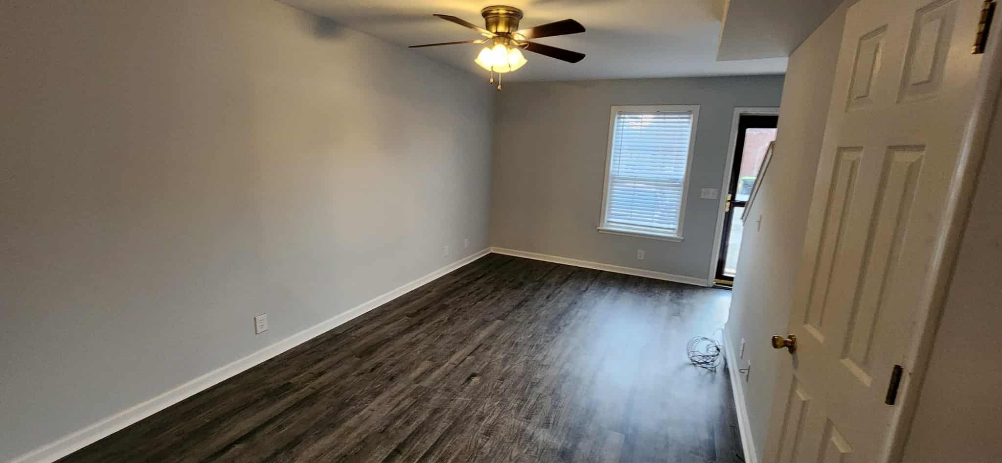 289 Raleigh Drive, Unit B Clarksville, TN 37043 - Photo 2 of 22 wooden floor in an empty room with a window