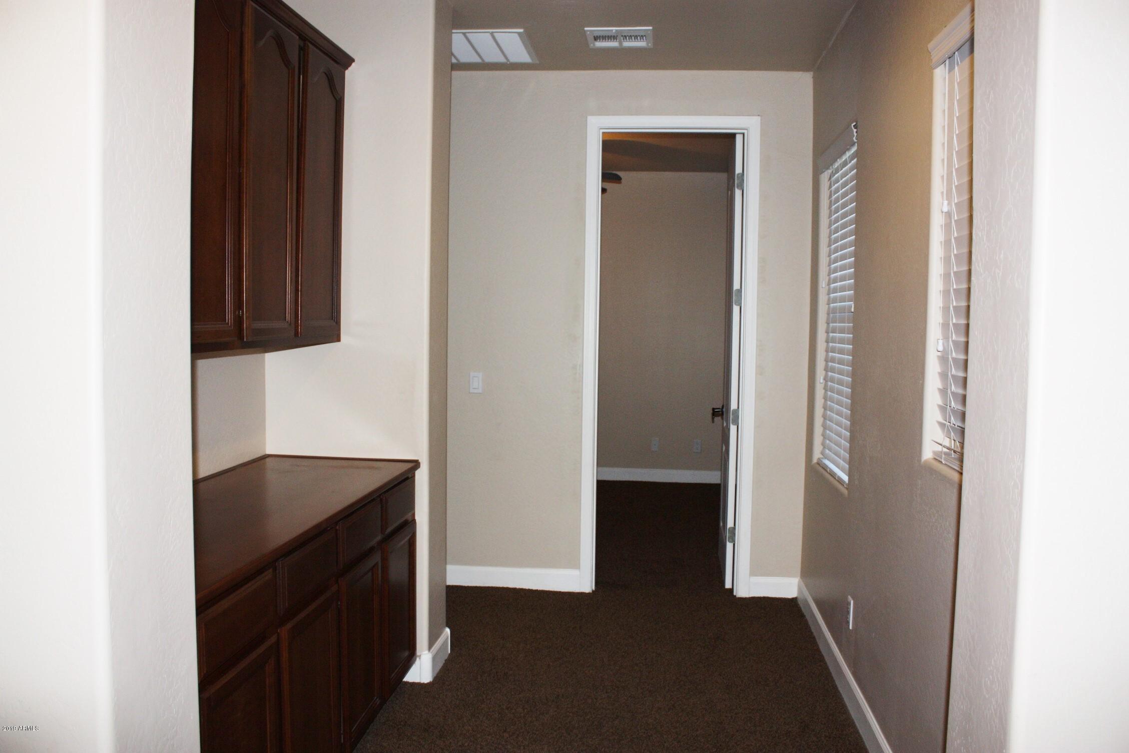 7009 West Fremont Road Laveen, AZ 85339 - Photo 45 of 64 Hall to bedroom 3 & 4