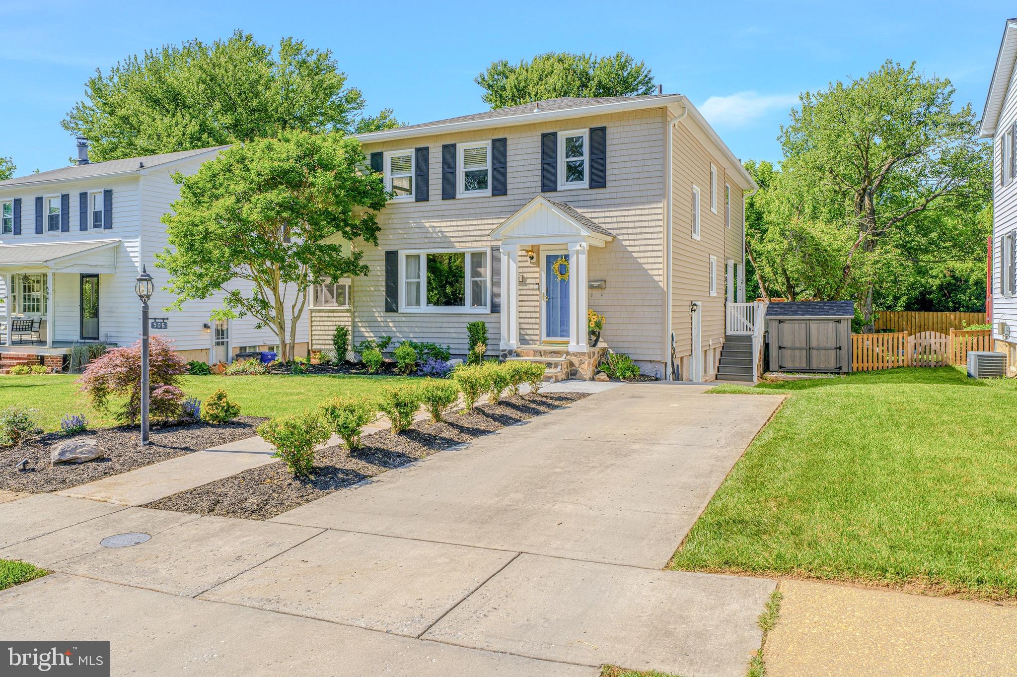 506 Brook Road Baltimore, MD 21286 - Photo 47 of 56 a front view of a house with a garden and tree