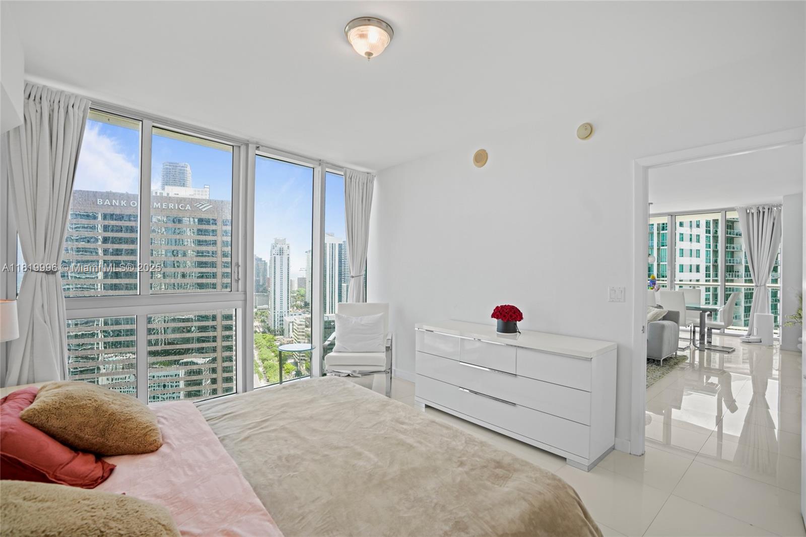 485 Brickell Avenue, Unit 3608 Miami, FL 33131 - Photo 22 of 43 a bedroom with a bed and windows