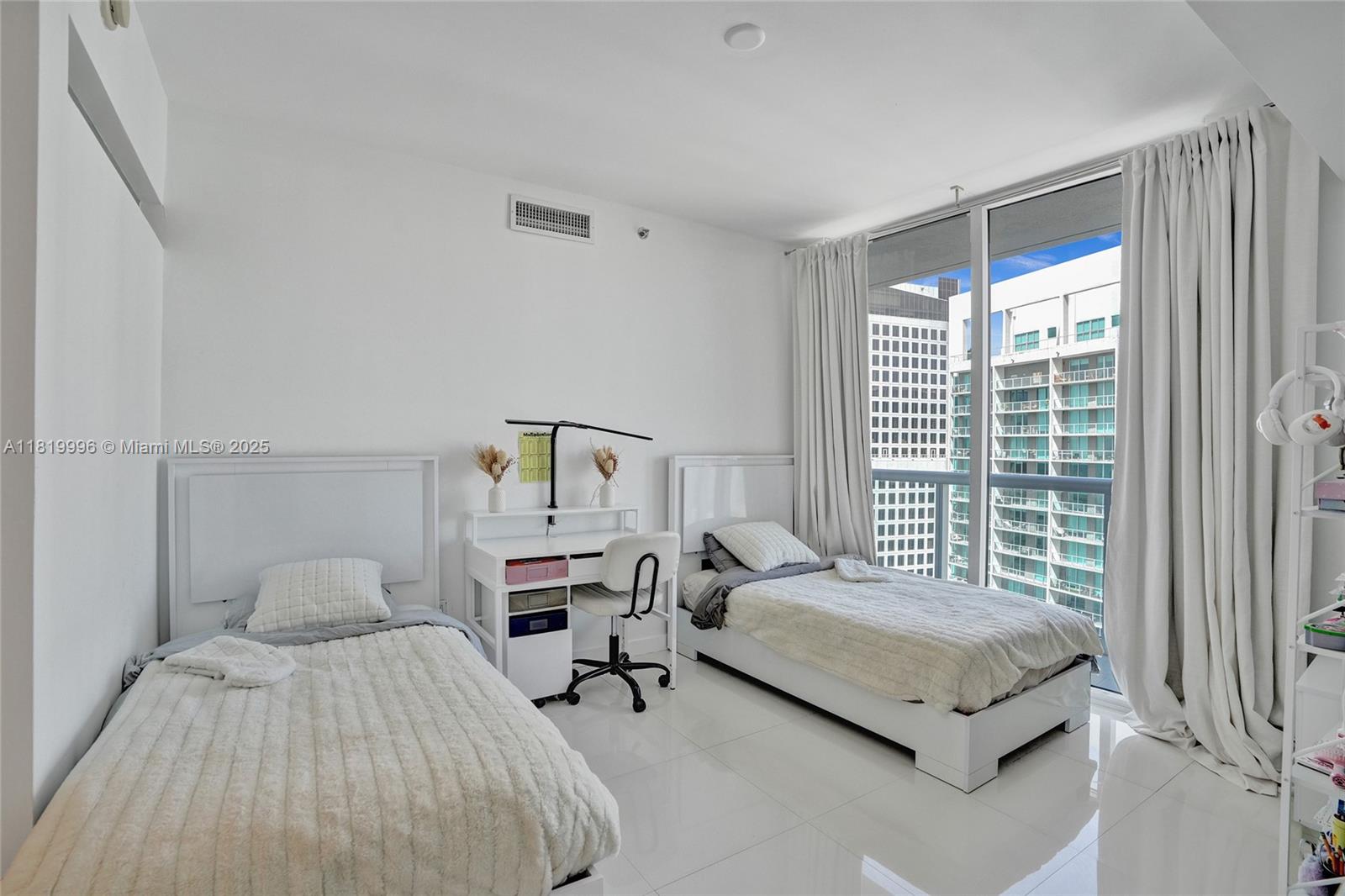 485 Brickell Avenue, Unit 3608 Miami, FL 33131 - Photo 32 of 43 a bedroom with a bed and a window