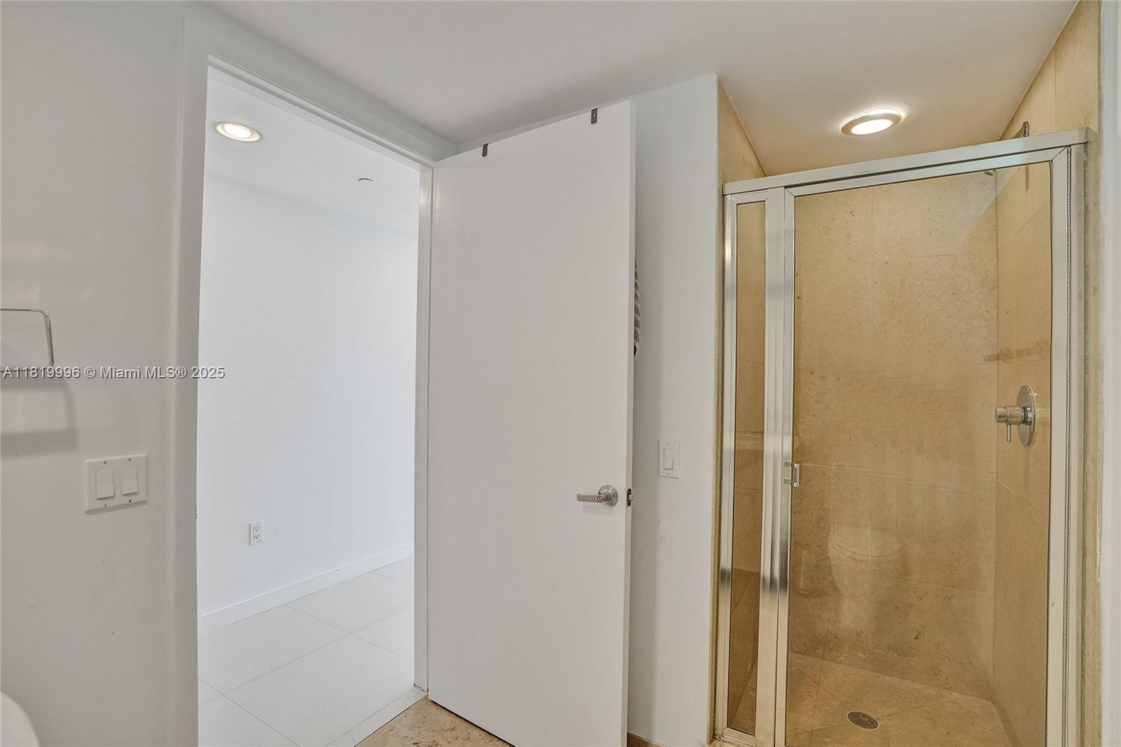 485 Brickell Avenue, Unit 3608 Miami, FL 33131 - Photo 34 of 43 a bathroom with a shower and a glass door