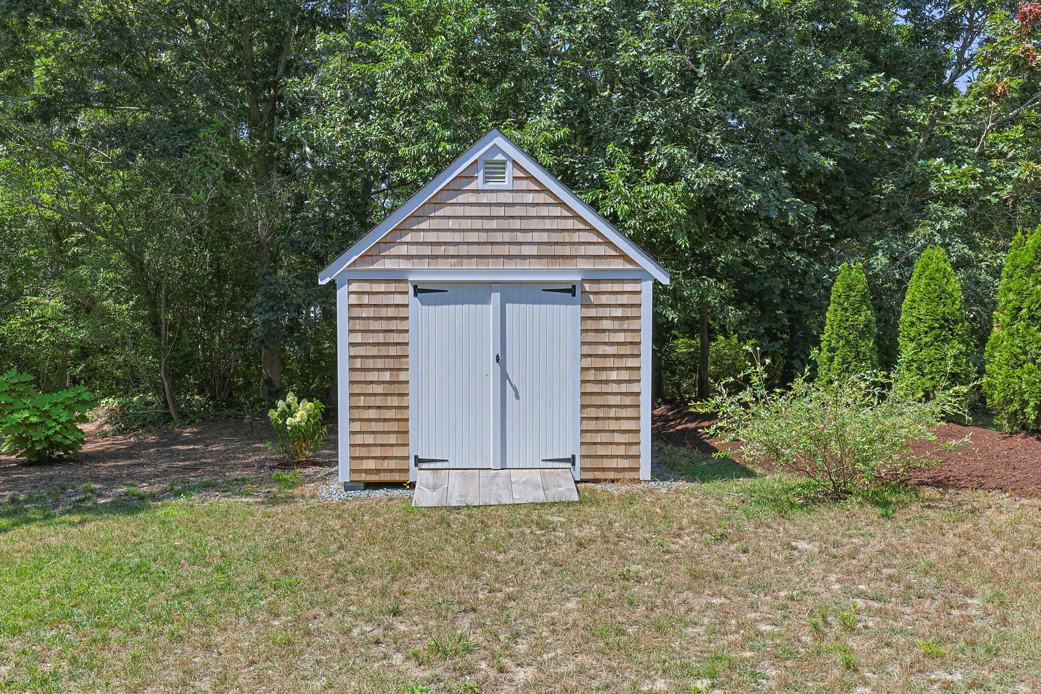 58 Stepping Stones Road Chatham, MA 02633 - Photo 45 of 52 a view of a house with a yard and large tree