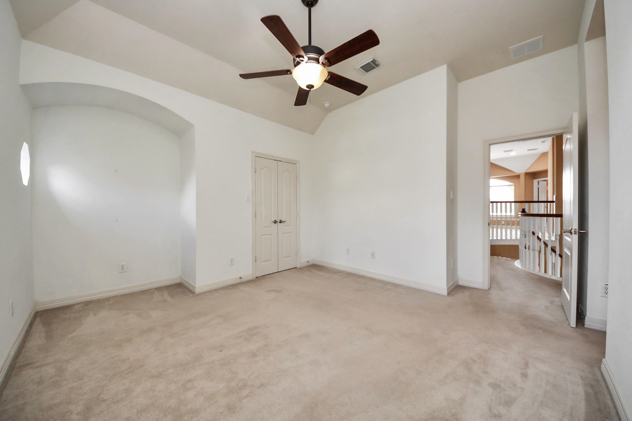17618 Raven Canyon Lane Houston, TX 77095 - Photo 34 of 45 Elegant bedroom with neutral tones, large windows, and direct access to an attached bath.