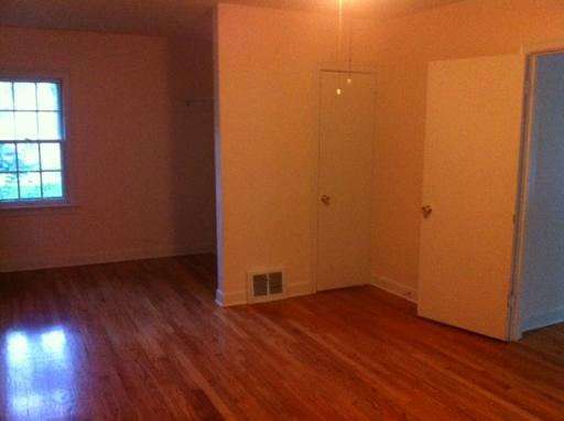 1339 183rd Street Homewood, IL 60430 - Photo 12 of 16 an empty room with wooden floor and windows