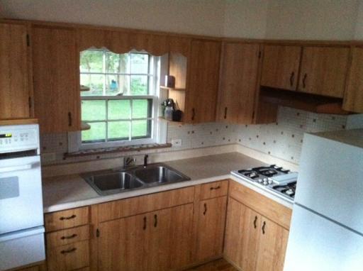 1339 183rd Street Homewood, IL 60430 - Photo 7 of 16 a kitchen with sink a window and cabinets