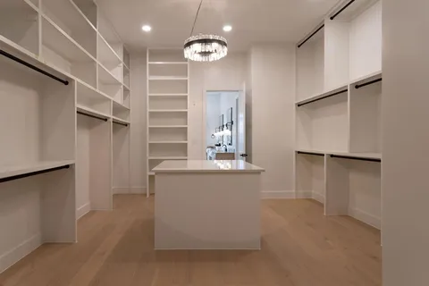 a view of kitchen with cabinets and wooden floor