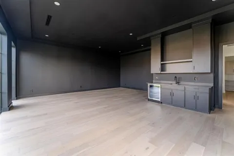 a view of a kitchen with a sink and cabinets