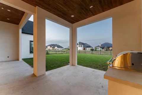 a view of an empty room with a fireplace