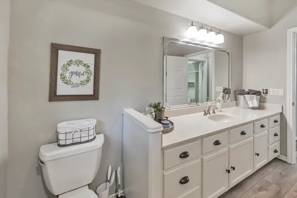 a bathroom with a double vanity sink and a mirror