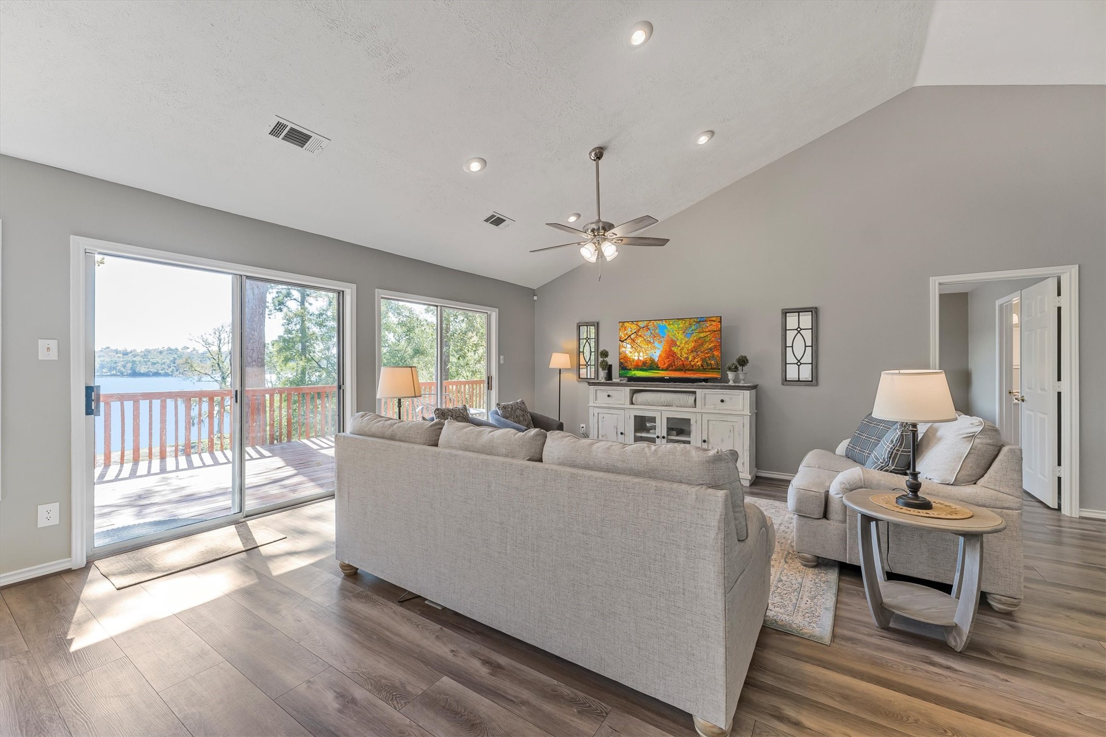 123 Palisade Circle Huntsville, TX 77320 - Photo 34 of 50 a living room with furniture and a flat screen tv