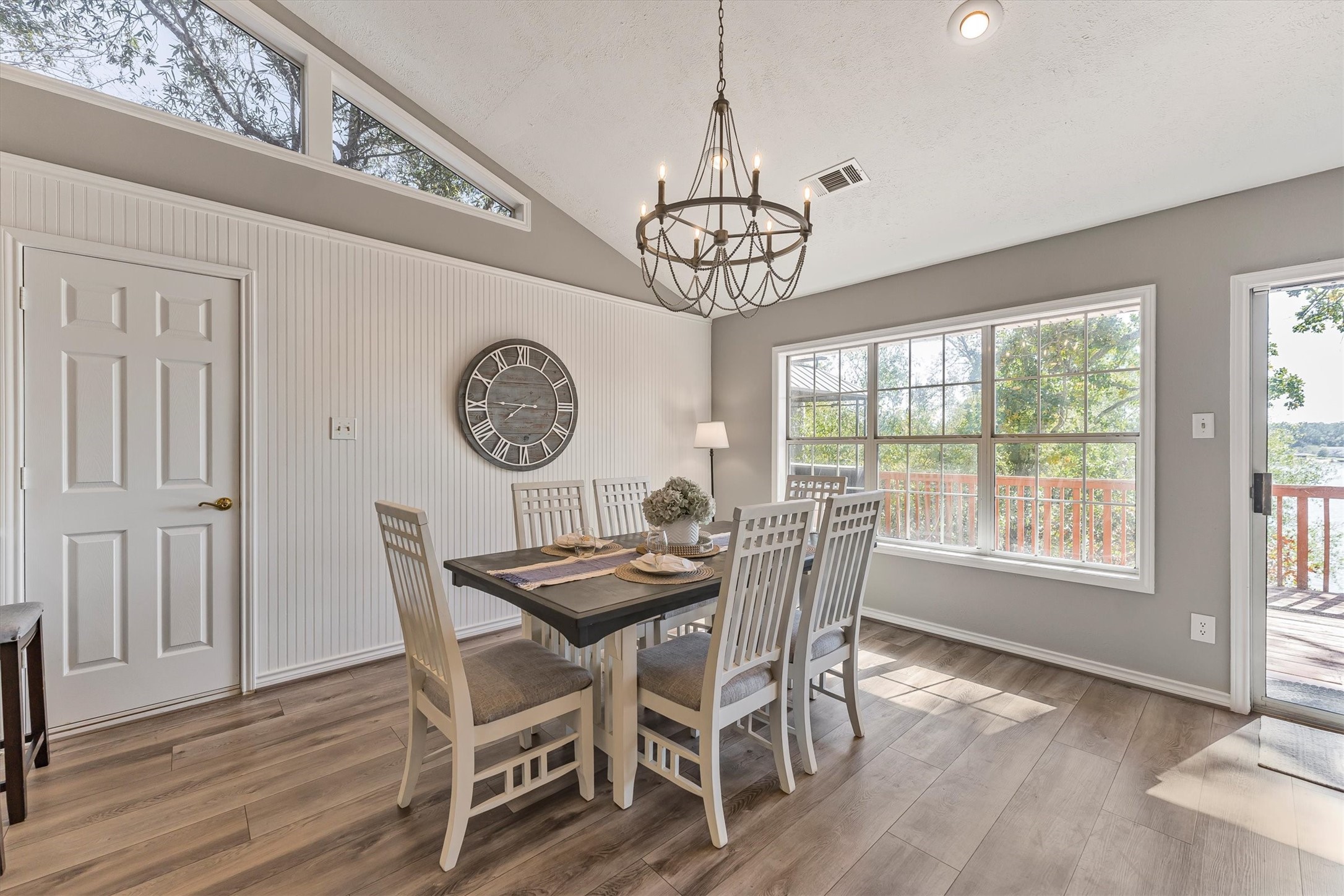 123 Palisade Circle Huntsville, TX 77320 - Photo 35 of 50 a view of a dining room with furniture a chandelier and wooden floor