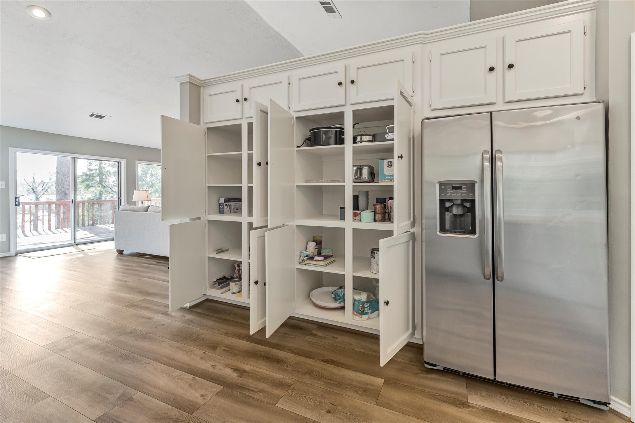 123 Palisade Circle Huntsville, TX 77320 - Photo 43 of 50 a walk in closet with wooden floor and windows